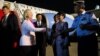 U.S. Secretary of State Hillary Rodham Clinton, second left, is greeted upon her arrival in Jakarta, Indonesia by dignitaries on Monday, Sept. 3, 2012.