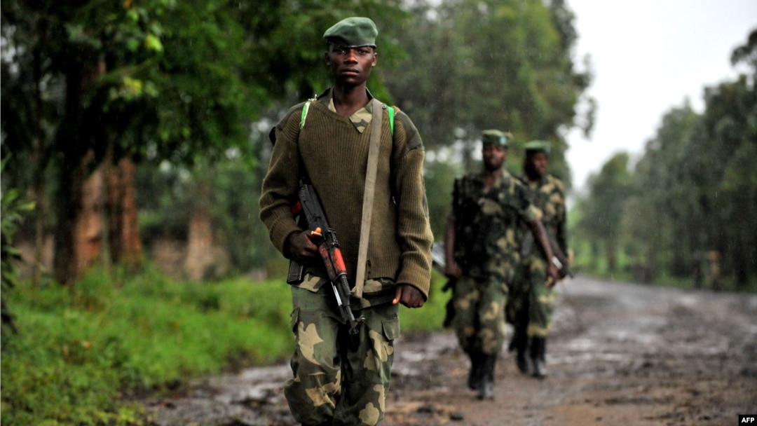 M23 rebel group soldiers patrol in Rangira, near Rutshuru, DRC, October 17, 2012.