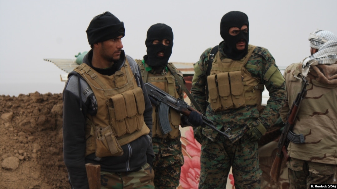 On the front lines in the western countryside, Hashd Shaabi soldiers say Islamic State militants continue to attack with car bombs, in Nineveh province, Iraq, on Dec. 15, 2016.