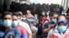 People wait for the COVID-19 vaccine at Juanda International Airport, as cases surge in Sidoarjo, East Java Province, Indonesia July 22, 2021. (Antara Foto/Umarul Faruq/via Reuters)