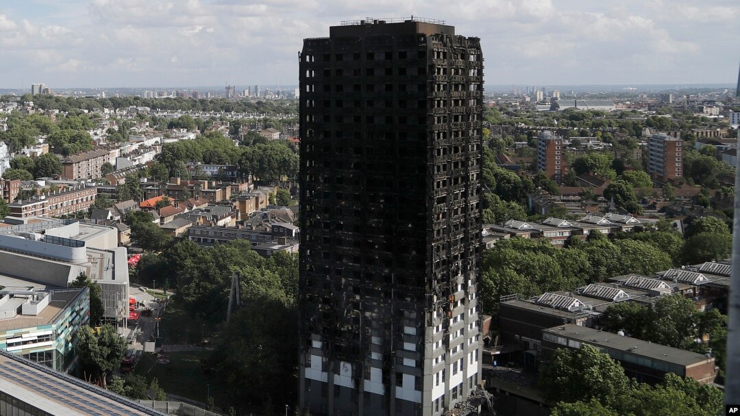 The scorched facade of the Grenfell Tower in London, June 15, 2017, after a massive fire raced through the 24-story high-rise apartment building in west London early Wednesday. 