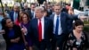 President Donald Trump walks to an interview on the North Lawn of the White House, Friday, June 15, 2018, in Washington. 