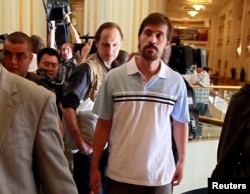 U.S. journalist James Foley, right, is shown May 18, 2011. Foley was kidnapped on Nov. 22, 2012, in northern Syria.