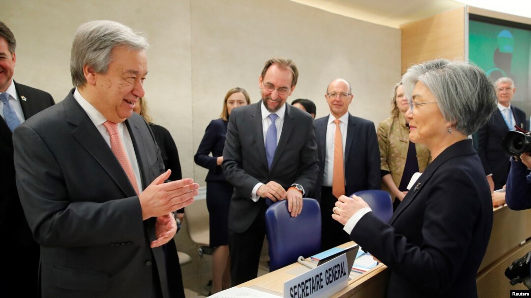 U.N. Secretary-General Antonio Guterres greets Kang Kyung-wha, South Korea's foreign minister, at the Human Rights Council at the United Nations in Geneva, Switzerland, Feb. 26, 2018. 
