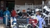 FILE - Health worker in a protective suit works in the makeshift emergency unit at Steve Biko Academic Hospital in Pretoria, South Africa, Jan. 11, 2021.