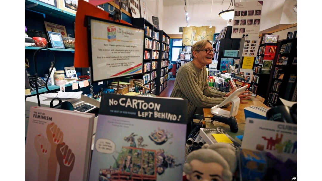 Dan Iddings, owner of Classic Lines, a bookstore about a half-mile from Tree of Life synagogue, works in his shop in Pittsburgh, Nov. 20, 2018.