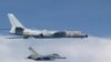 This photo taken July 22, 2017, by Taiwan's Defense Ministry shows a Taiwanese jet intercepting an H-6 bomber from China over the East China Sea, part of the Pacific and home to small islands whose ownership is disputed by China, Japan and Taiwan.