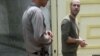 In this photo shared on social media, Iranian journalist Masoud Kazemi is seen handcuffed after being arrested in Tehran, May 22, 2019, for alleged security offenses.