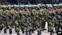FILE - Nigerian soldiers march during 58th anniversary celebrations of Nigerian independence, in Abuja, Nigeria, Oct. 1, 2018. 