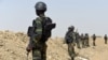 FILE - A picture taken on February 17, 2015, shows Cameroonian soldiers patrolling in the Cameroonian town of Fotokol, on the border with Nigeria, after clashes occurred between Cameroonian troops and Nigeria-based Boko Haram insurgents.