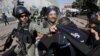 FILE - Israeli border policemen detain a Palestinian journalist during a protest to show solidarity with his colleague Muath Amarna, who was shot in his eye, in Bethlehem, in the Israeli-occupied West Bank, Nov. 17, 2019.