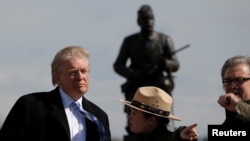 FILE - President Donald Trump pumps his fist as he finishes speaking during an event at the Whirlpool Corporation facility in Clyde, Ohio, August 6, 2020.