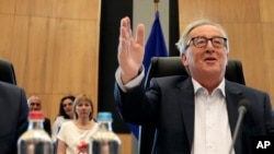 FILE - European Commission President Jean-Claude Juncker chairs a meeting of the college of commissioners at EU headquarters in Brussels, July 24, 2019. 