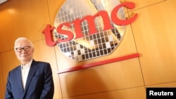 FILE - Taiwan Semiconductor Manufacturing Co. chairman Morris Chang poses during an interview in Taiwan, Oct. 5, 2017.