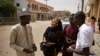 FILE - Zainab Sulaiman Umar, 26, center, a candidate for the State House of Assembly in Kumbotso constituency, Kano state, speaks to residents in Kano, northern Nigeria, Feb. 15, 2019.