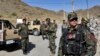 Afghan special forces stand guard at the site of a suicide car bomb explosion that killed at least four people, on the outskirts of Kabul, Afghanistan, Sept. 12, 2019.