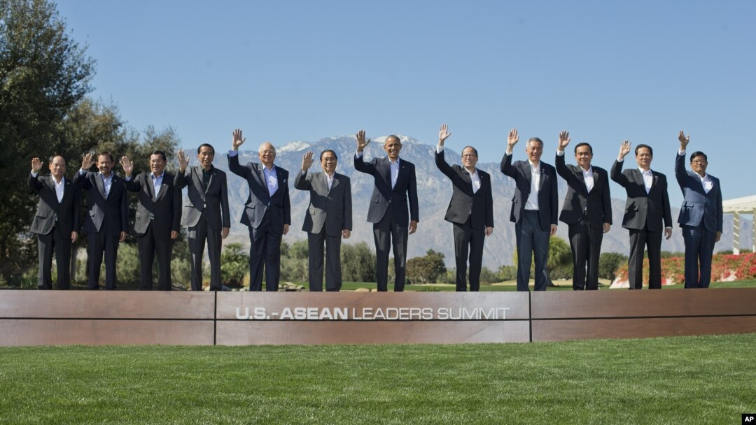 President Barack Obama, center, and leaders of ASEAN, the 10-nation Association of Southeast Asian Nations, wave as they pose for a group photo at the Annenberg Retreat at Sunnylands in Rancho Mirage, Calif., Tuesday, Feb. 16, 2016. With Obama are from left are, ASEAN's Secretary General Le Luong Minh, Brunei's Sultan Hassanal Bolkiah, Cambodia's Prime Minister Hun Sen, Indonesian President Joko Widodo, Malaysia Prime Minister Najib Razak, Laos President Choummaly Sayasone, Philippine President Benigno Aquino III, Singapore Prime Minister Lee Hsien Loong, Thailand Prime Minister Prayuth Chan-ocha, Vietnam Prime Minister Nguyen Tan Dung, and Myanmar Vice President Nyan Tun. (AP Photo/Pablo Martinez Monsivais)