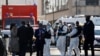 Police officers secure the area where an attacker stabbed a female police administrative worker, in Rambouillet, near Paris, France, April 23, 2021. 