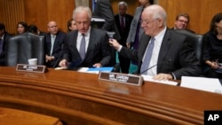 Chairman Sen. Bob Corker, R-Tenn., left, talks with Ranking member Sen. Ben Cardin, D-Md., before the start of a Senate Foreign Relations Committee hearing on North Korea and President Donald Trump's nuclear authority, on Capitol Hill in Washington, Nov. 14, 2017.
