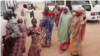 Screen shot of the bus provided by state government carrying freed hostages, who were held by bandits, driving through transit site after being brought from where they were freed in Gusau, Zamfara state on Jan. 04, 2022.
