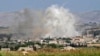 Smoke billows above buildings during reported shelling by government and allied forces, in the town of Hbeit in the southern countryside of rebel-held Idlib province, Syria, May 3, 2019.