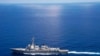 USS Lassen (DDG 82) operates in international waters near the Chinese People's Liberation Army (Navy) Jianghu V-class frigate Dongguan (560) while on patrol in U.S. 7th Fleet at South China Sea, Sep 29, 2015.