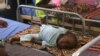 FILE - A child who sustained brain damage resulting from cerebral spinal meningitis is seen at the Save the Children stabilization ward in Maiduguri, Nigeria.