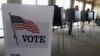 FILE - Voters cast ballots in Hinsdale, Ill., March 18, 2014. 