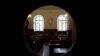 FILE - A view shows the courtroom after the initial extradition hearing for Rwandan genocide suspect Felicien Kabuga, at the Paris courthouse, France, May 20, 2020. 