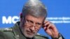 FILE - Iranian Defense Minister Amir Hatami adjusts a headphone during the annual Moscow Conference on International Security in Moscow, April 4, 2018.