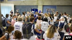 FILE - Emergency Medical Service (SAMU) staff arrive to the Pole Caraibes international airport in Pointe-a-Pitre to help stretched medical teams on the French Caribbean archipelago of Guadeloupe, on Aug. 10, 2021.