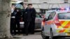 FILE - Police officers attend to the scene of a stabbing in southeast London, Britain, Feb. 1, 2013. Metropolitan Police recorded 40,147 offenses involving a knife or bladed weapon in the first three months of this year.