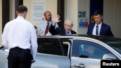 Britain's Prime Minister Boris Johnson leaves after his visit to the Royal Cornwall Hospital in Truro, Britain, Aug. 19, 2019. 