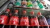 FILE - Sugar-sweetened drinks in a store's refrigerator, Feb. 20, 2013
