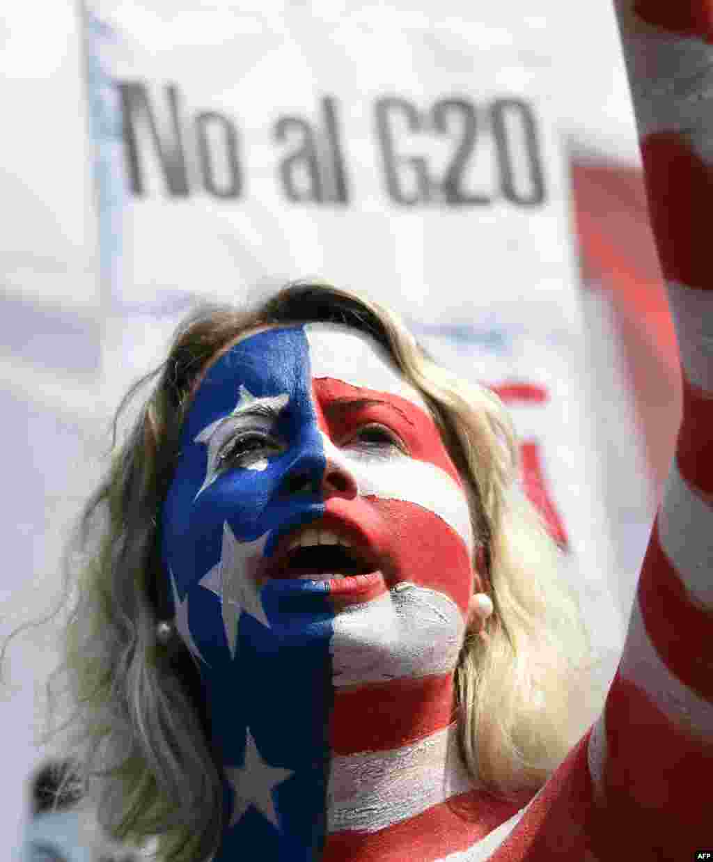 Body-painted activists take part in a protest against the G-20 Leaders' Summit taking place in Buenos Aires, Argentina.