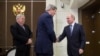 U.S. Secretary of State John Kerry, left, is welcomed by Russian President Vladimir Putin at the presidential residence of Bocharov Ruchey in Sochi, Russia, May 12, 2015. 