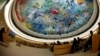 Wu Hailong, special envoy of China's Foreign Ministry (L), addresses the Human Rights Council Universal Periodic Review session at the European headquarters of the United Nations in Geneva, Oct. 22, 2013. 