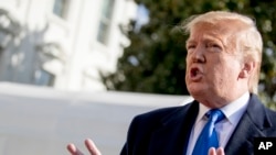 President Donald Trump speaks to reporters on the South Lawn of the White House, in Washington, Nov. 8, 2019.