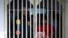 FILE - Jailed Taliban fighters are seen inside the Pul-e-Charkhi prison in Kabul, Afghanistan, Dec. 14, 2019. 