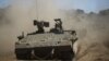 Israeli soldiers manuever a tank during a military exercise in the northern part of the Israeli-annexed Golan Heights on Sept. 7, 2017. Syria said Israeli airstrikes hit a facility in the country's west linked by Western nations to Syria's chemical weapons program.