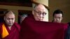 The Dalai Lama gestures as he arrives to give a religious talk at the Tsuglakhang temple in Dharamsala, India, Oct. 23, 2011.