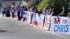 FILE - Democratic campaign supporters line the road leading to the New Hampshire Institute of Politics at St. Anselm College prior to a debate for New Hampshire's 1st Congressional District in Manchester, N.H., Sept. 5, 2018. 
