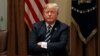 U.S. President Donald Trump waits for reporters to leave the room after speaking about his summit with Russia's President Putin during a meeting with members of the U.S. Congress at the White House in Washington, July 17, 2018. 