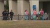 This photo taken from video provided by WEAR-TV shows emergency responders near the Naval Air Base Station in Pensacola, Fla., Dec. 6, 2019. 