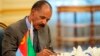 FILE - Eritrean President Isaias Afwerki signs a peace accord with Ethiopia in Jiddah, Saudi Arabia on Sunday, Sept. 16, 2018. 