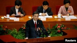 Zhou Qiang, President of China's Supreme People's Court, gives a speech during the third plenary session of the National People's Congress (NPC) at the Great Hall of the People, in Beijing, March 12, 2017. 