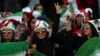 An Iranian woman flashes a victory sign during a soccer match between Iran and Cambodia in the 2022 World Cup qualifier at the Azadi (Freedom) Stadium in Tehran, Iran, Oct. 10, 2019. Iranian women were allowed into the stadium for the first time in years.