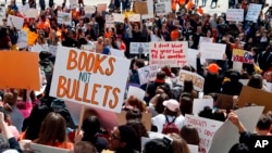 Hundreds of students gather, April 20, 2018, at the Capitol in St. Paul, Minn., to protest gun violence, part of a national high school walkout on the 19th anniversary of the Columbine shootings.