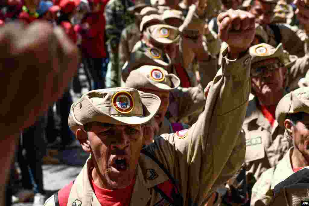 Members of Venezuela&#39;s Bolivarian militia demonstrate in support of President Nicolas Maduro during a commemoration for the &#39;27th Anniversary of the Military Rebellion of the 4FEB92 and National Dignity Day,&#39; at Bolivar Square in Caracas.