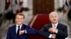 French President Emmanuel Macron and Iraq's President Barham Salihat greet each other with an elbow bump as they attend a news conference in Baghdad, Iraq, Sept. 2, 2020. 